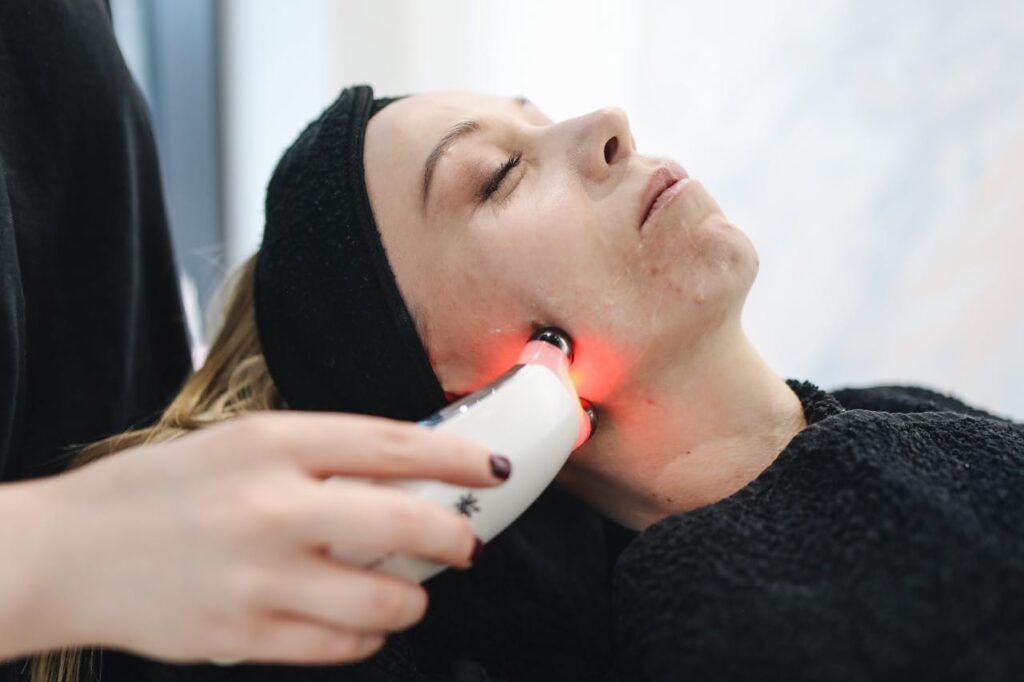 pexels photo 3738355 An adult woman receives a laser facial treatment in a modern skincare clinic.